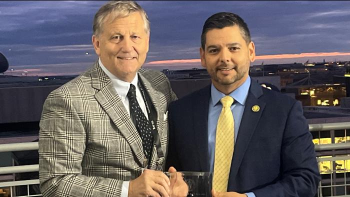 Dr. Naunheim presents Congressman Ruiz with Award