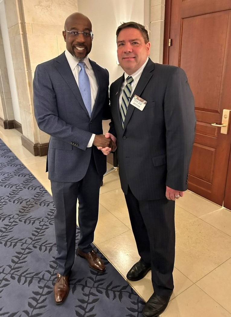 "Sen. Raphael Warnock and Sr. James St. Louis"